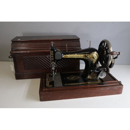 630 - A vintage oak cased singer sewing machine