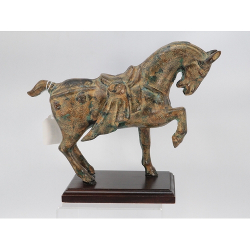 633 - A cast metal tang style horse with aged patina finish