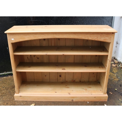 116 - Pine low bookcase measuring approx 121cm w x 34cm d x 93cm