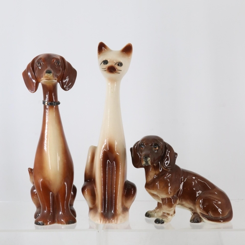 181 - Three retro ceramic ornaments to include two dogs and a cat