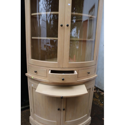 226 - Neptune Oak corner cabinet measuring approx 74cm x 74cm Height 210cm Top half glazed unit with shelv... 