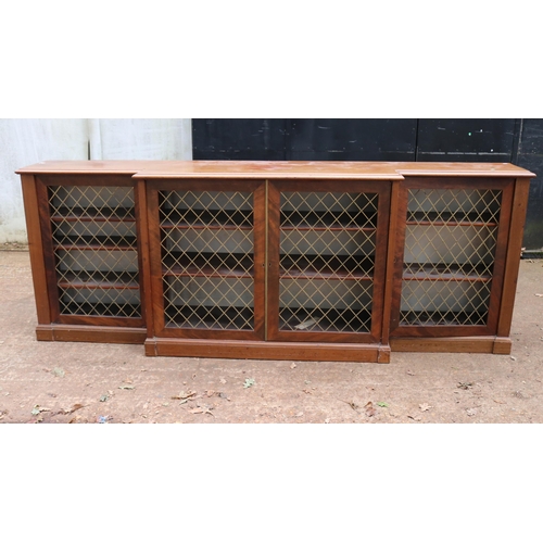 261 - Break front mahogany bookcase with brass grill doors measuring approx 241cm w x 45cm d x 89cm h