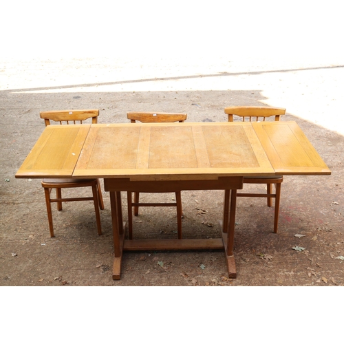 336 - Oak drawer leaf table with three chairs. Table top needs attention from use. size approx. 107cms x 7... 