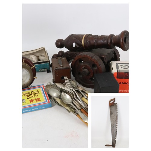 67 - A mixed clearance lot to include; a wooden cannon, cameras, fossils, barometer, cutlery, and large s... 