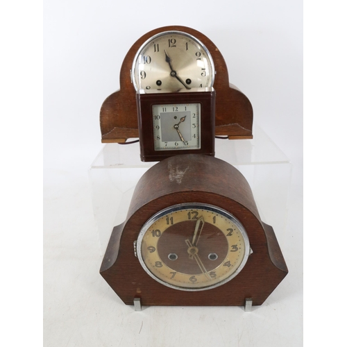 275 - Two Oak cased mantle clocks, Bakelite electric clock, selection of vintage tins, lamp etc