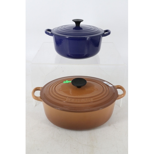 272 - Le Creuset oven pot and cover together with a similar blue oven dish and cover