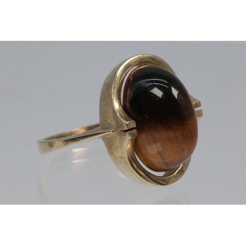 55 - 9ct gold ring set with large tigers eye stone. overall weight approx.5.2