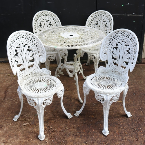 7 - Cast aluminium garden table and 4 matching chairs (weathered)