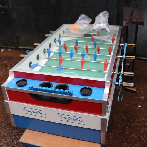 17 - Coin operated table football with spare springs attachments etc with base(pictured not on base) made... 