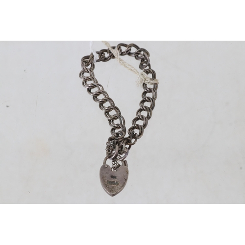 28 - A Sterling Silver hallmarked bracelet with heart-shaped lock.