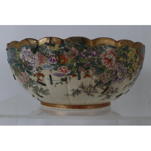 41 - Japanese bowl heavily decorated with chrysanthemums etc, restored with staples measures approx 10inc... 