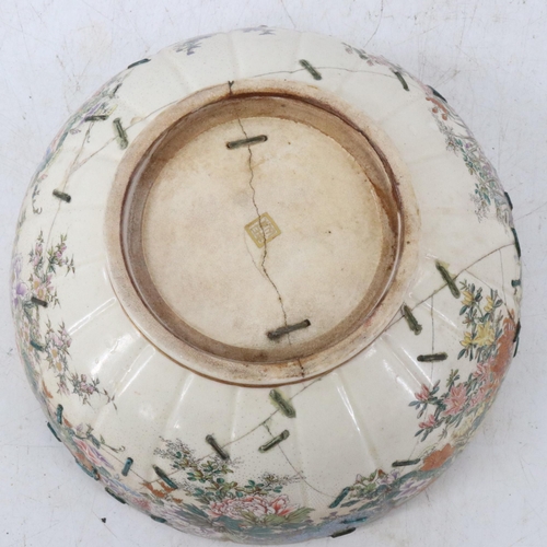 41 - Japanese bowl heavily decorated with chrysanthemums etc, restored with staples measures approx 10inc... 