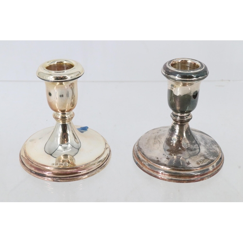 33 - Two similar silver weighted 4inch tall candlesticks