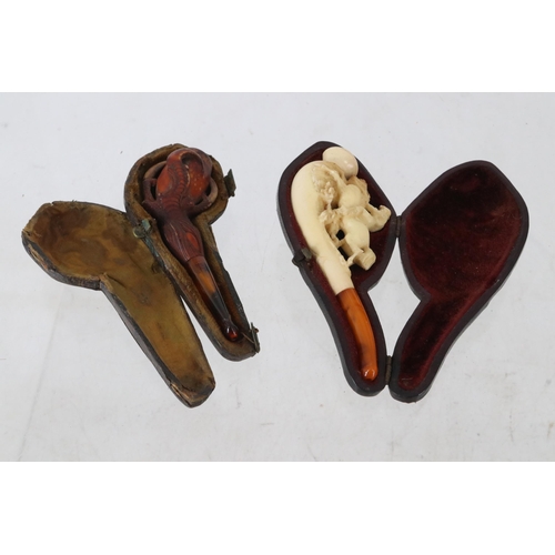 25A - Two cased Meerschaum pipes.