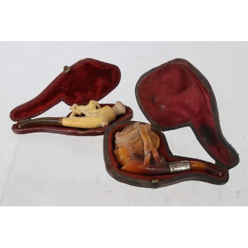 25B - Two cased Meerschaum pipes.