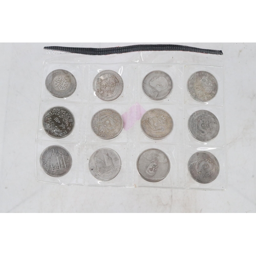 32B - A set of 12 Chinese coins.