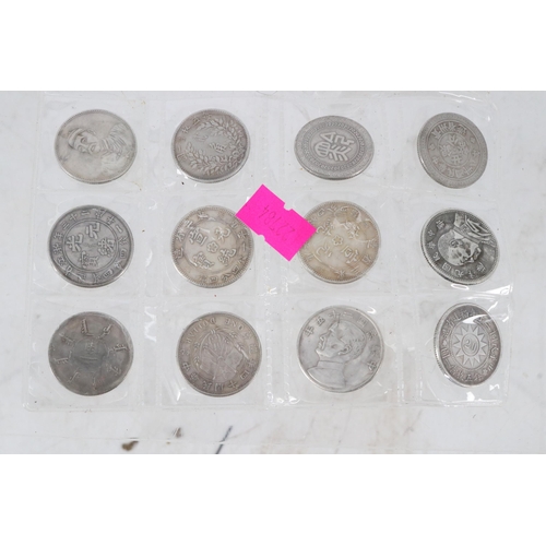 32B - A set of 12 Chinese coins.