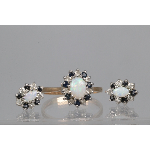 31 - 9ct gold opal, diamond and sapphire ring together with matching earrings. Overall weight approx. 3.4... 