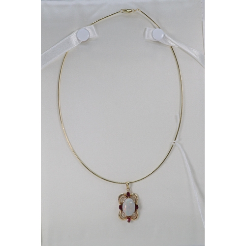 44 - 9ct gold necklace and opal and ruby pendant. Overall weight approx. 9g