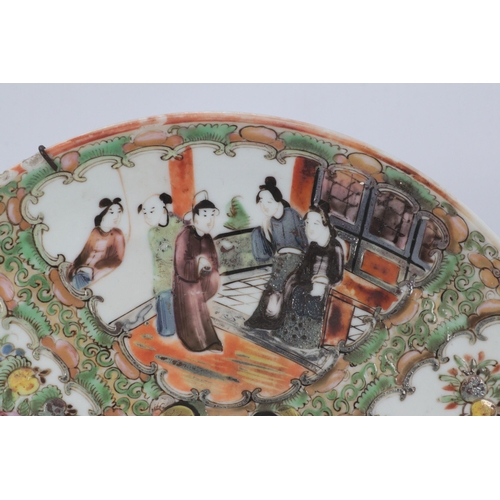 106 - A Chinese famille Rose plate decorated four panels and centre circle depicting scenes of people and ... 