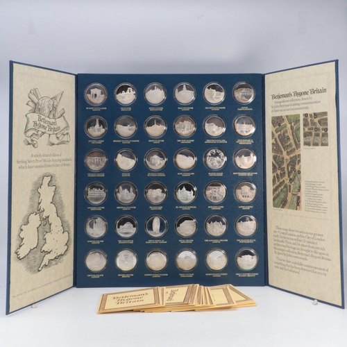 235 - BETJEMANS BYGONE BRITAIN. A mounted set of thirty six silver proof medals by John Pinches