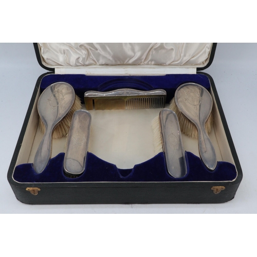 251 - Cased silver vanity set together with another (missing mirror)