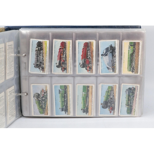 267 - Two binders containing complete sets of pre-war cigarette cards by various makers.  Also, five sets ... 