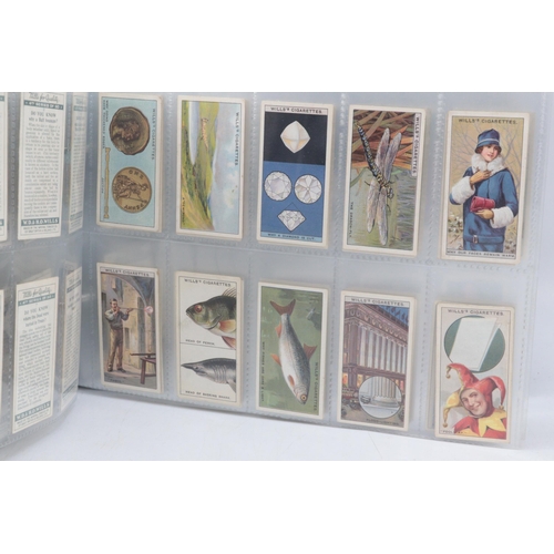 267 - Two binders containing complete sets of pre-war cigarette cards by various makers.  Also, five sets ... 