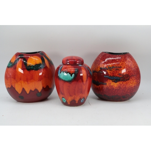 329 - Two Poole Pottery small purse vases (approx. 16cm tall each) together with a ginger jar