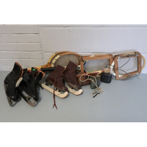 466 - Two pairs of vintage ice skates together with four tennis racquets and a whistle, eastern powder fla... 