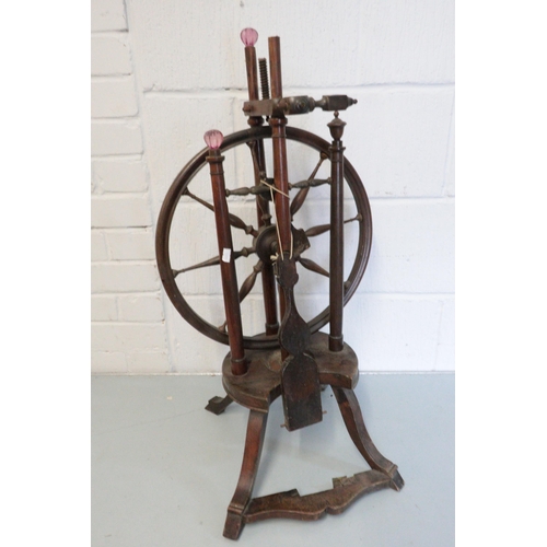 480 - Antique spinning wheel with some adaptions and in need of repair (approx. 77cm tall)