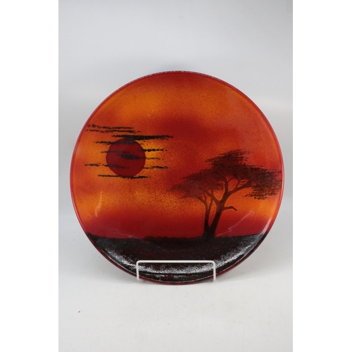 563 - A Poole Pottery charger measures approx. 40cm diameter signed to reverse Alan White