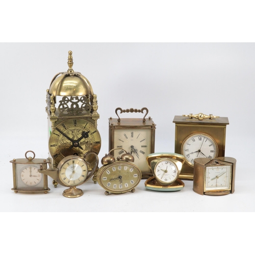 631 - A Smiths brass lantern /bell clock together with a quantity of bedside alarm clocks (8)