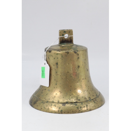 632 - A brass bell with impressed marks, approx. 14cm