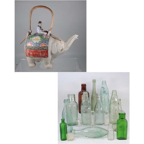 468A - A ceramic teapot in the form of an elephant together with a selection of vintage bottles, glass etc.