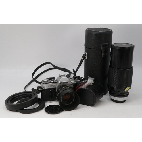 474 - Canon AE1 SLR camera with a 50mm prime lens, zoom lens and other accessories