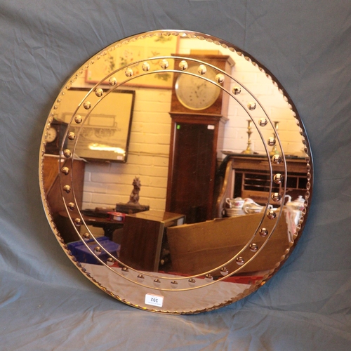 392 - Pink art deco circular wall mirror. size approx. 58cm diameter.