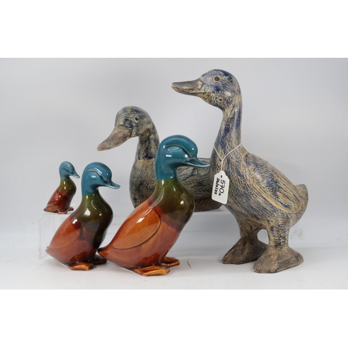 570A - Two ornamental ducks together with three graduated ceramic ducks (tallest duck approx. 29cm)