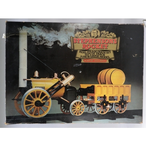 287 - A boxed Hornby railways Stephenson's rocket real steam train set with original box together with a b... 