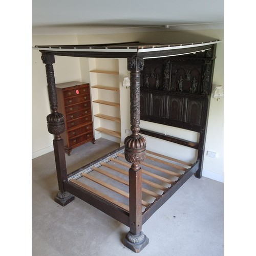 75 - Antique four poster bed with heavily carved decorated headboard, pillars and top measures approx 210... 