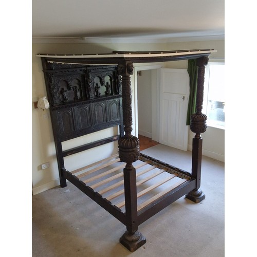 75 - Antique four poster bed with heavily carved decorated headboard, pillars and top measures approx 210... 