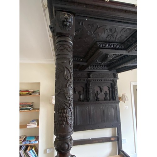 75 - Antique four poster bed with heavily carved decorated headboard, pillars and top measures approx 210... 