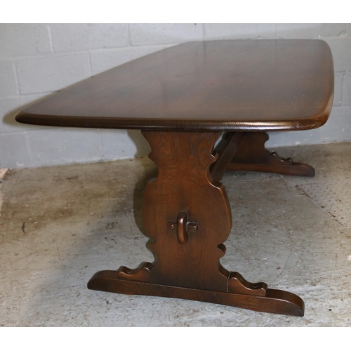 108 - Ercol dark finish refectory table measuring approx 6ft x 35inch  together with four windsor chairs.