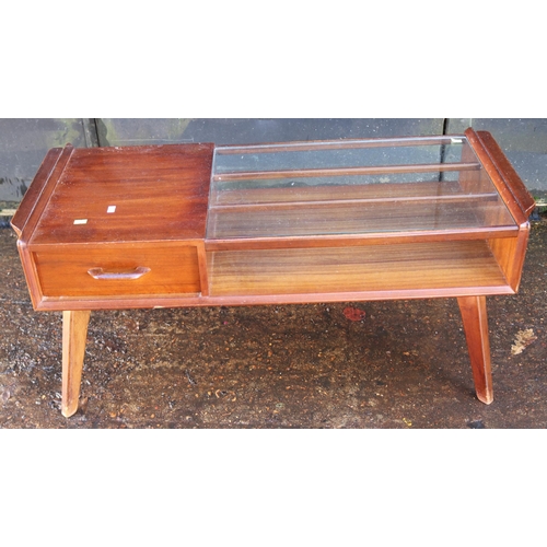 239 - A gold label E. Gomme (G-Plan) half glazed coffee table with double-ended drawer. It measures approx... 