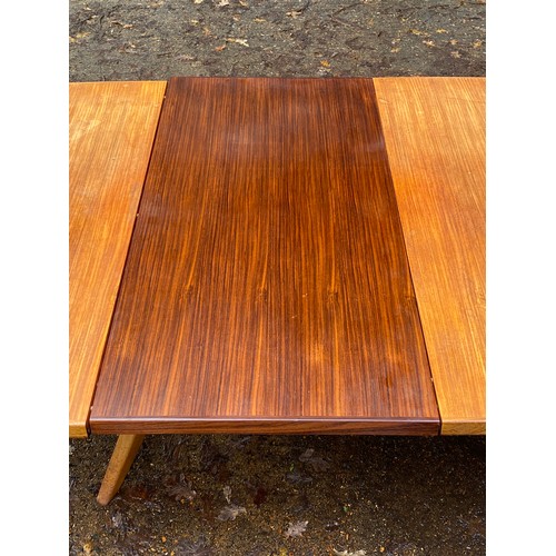 155 - A Gordon Russell for Heals extending dining table. measuring approx' 7'7