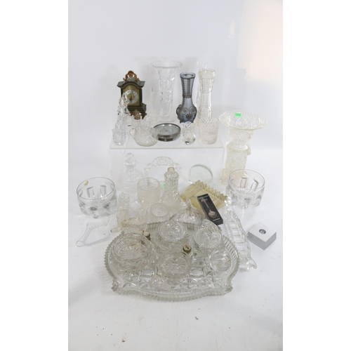 296A - A large quantity of assorted cutglass, pressed glass together with a unusual glass cased mantle cloc... 