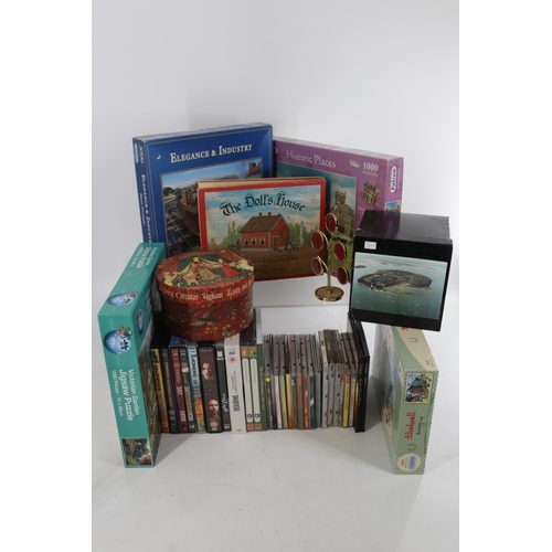 306A - A large quantity of household sundries including ceramics, glass, pictures, CDs puzzles etc