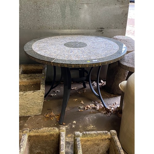 38 - Polished granite top table measuring approx 105cm diameter, with removable centre for parasol