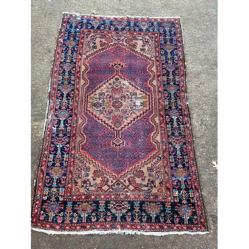 220 - Two oriental rugs with age, one measures approx' 128 x 206cm and the other approx' 130 x 189cm.