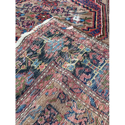 220 - Two oriental rugs with age, one measures approx' 128 x 206cm and the other approx' 130 x 189cm.